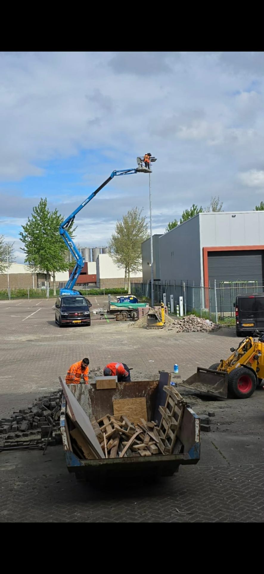 EscoPlus engineers installing outdoor lighting